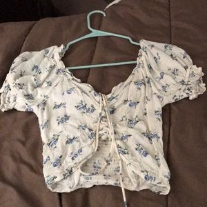 white crop top with little blue flower details!